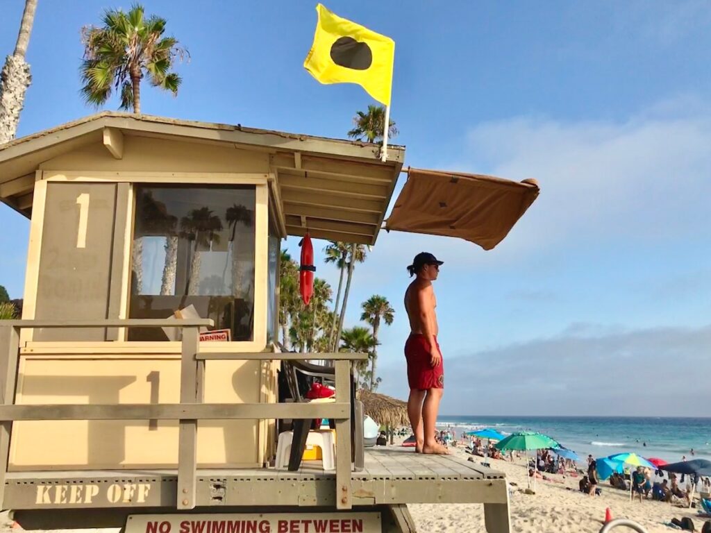 A lifeguard looks out enjoying one of the most exciting summer jobs.