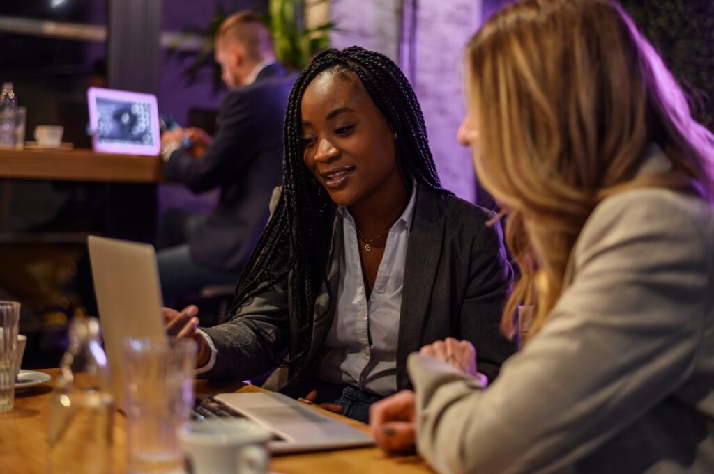 A career coach helps a woman use ai recruiting to focus her career building efforts.